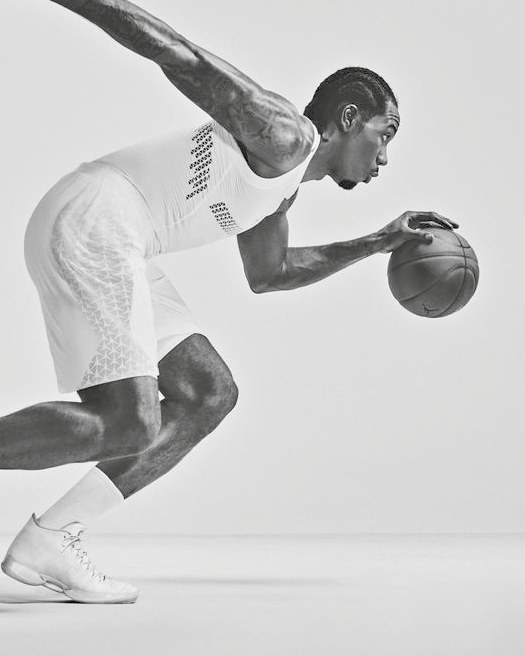An athlete dribbling a basketball in a Nike campaign photograph